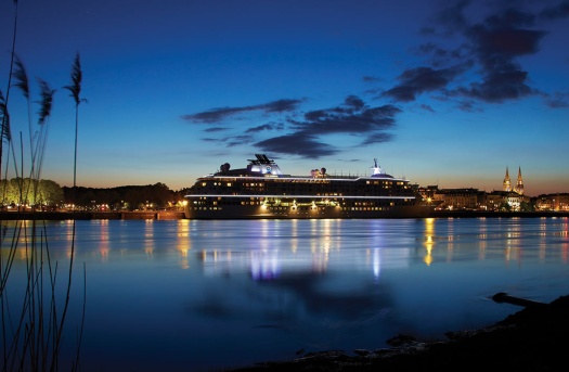 cruise ship lighted up at night