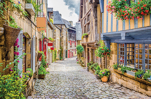 cobblestone road through old buildings