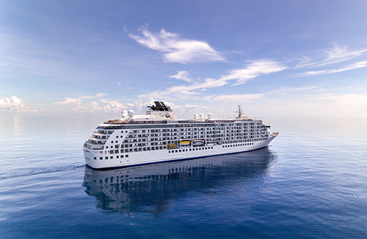 cruise ship in middle of ocean with clear skies